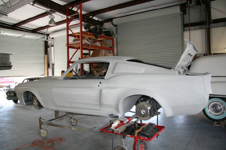 Once the fiberglass body kit was fitted and bonded to the original panels, ...