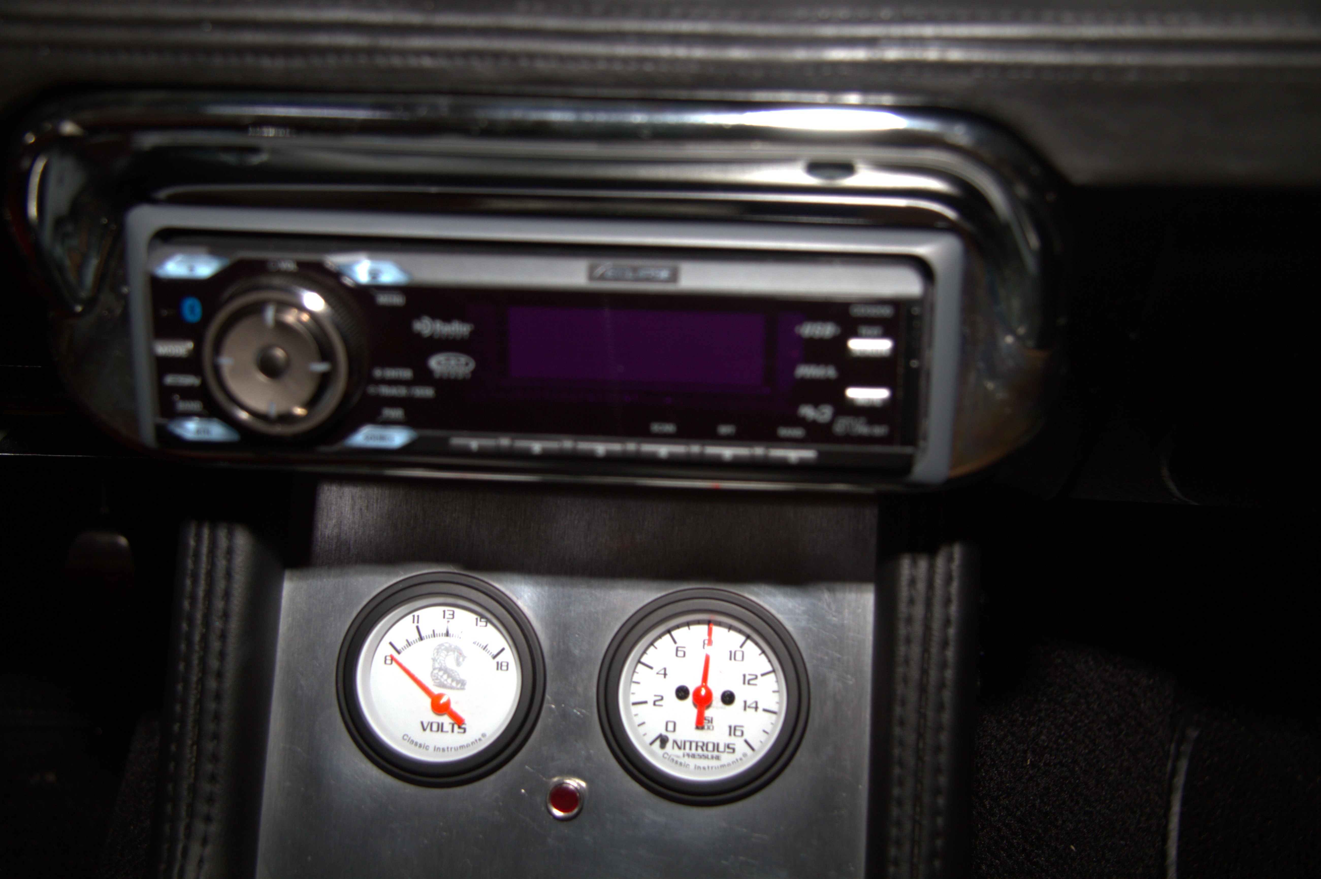 Custom Shelby Signature nitrous and volt gauges exclusive to the Black Mamba