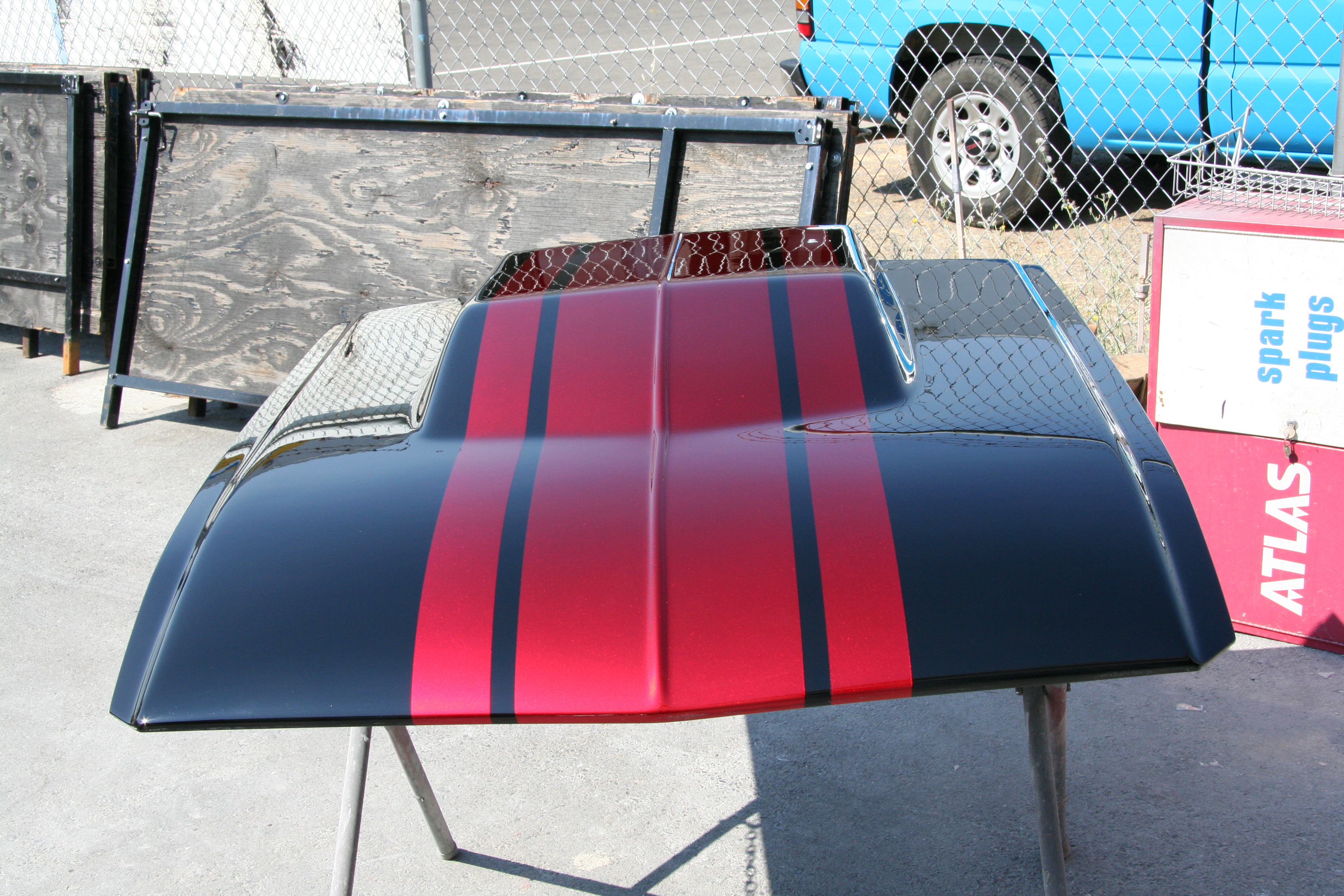 Sunlight reveals depth of silver metal flake beneath finish